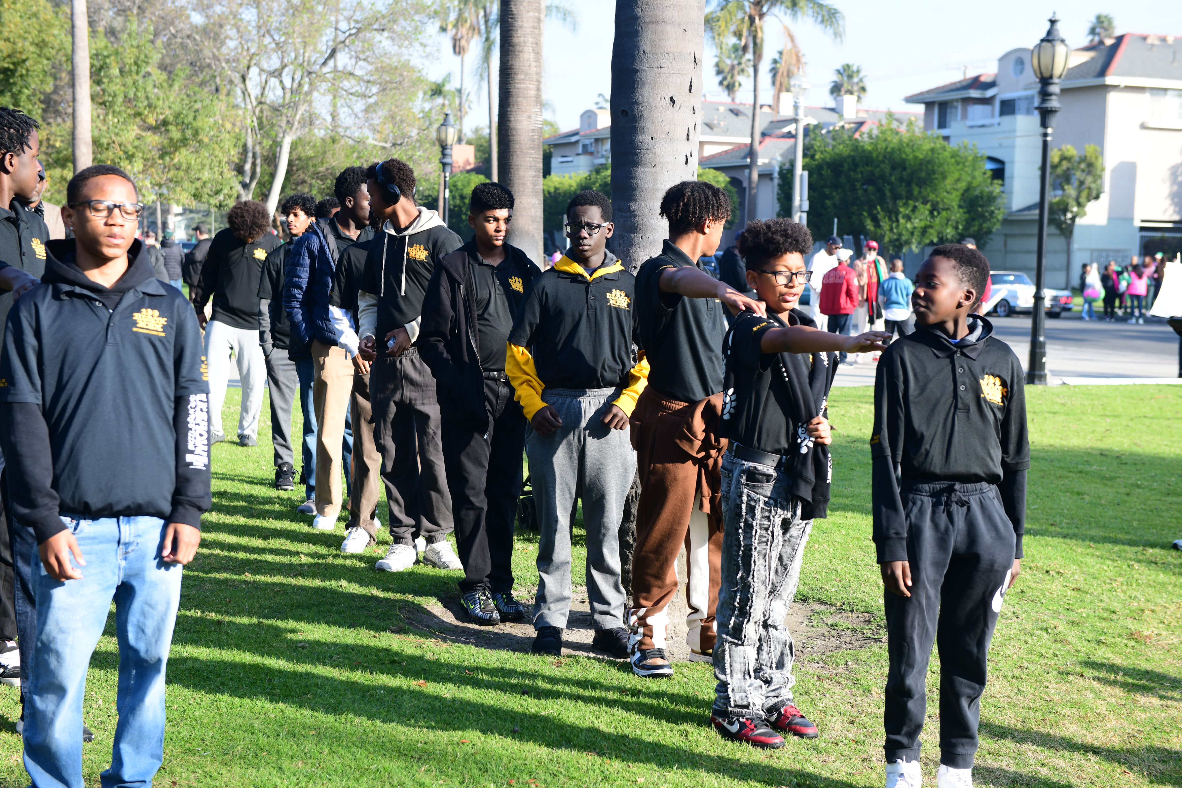 Group of young men in a line outdoors